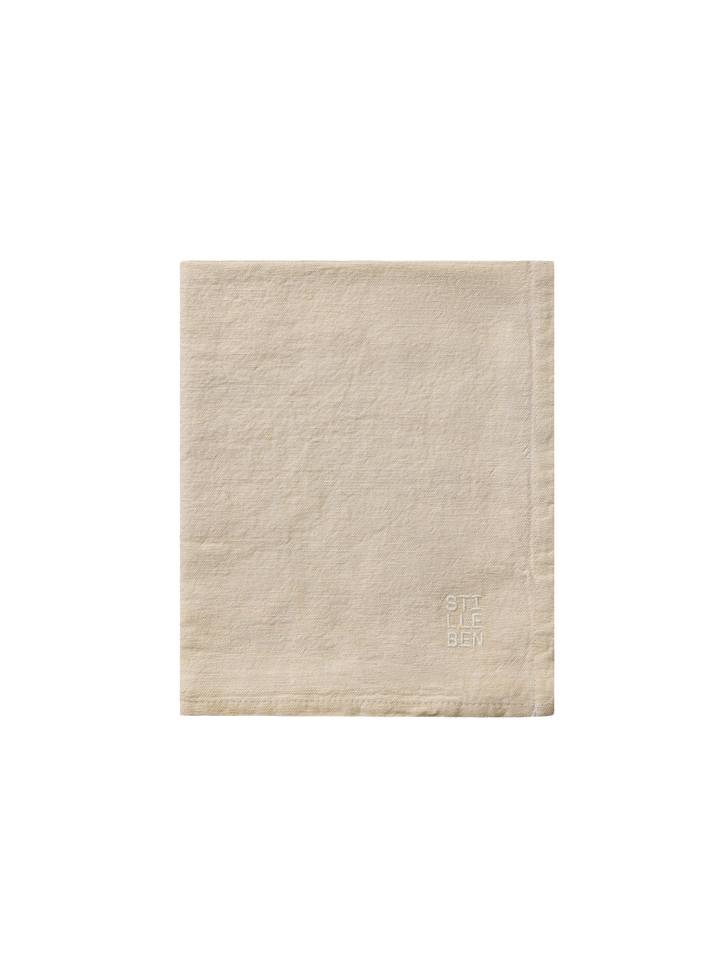 tea towel in sand